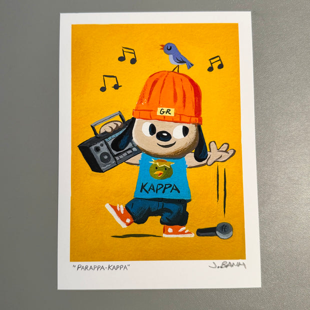 Illustration of PaRappa holding a boombox over his shoulder, dropping a microphone in one hand and smiling. He wears a Kappa design shirt and has a bird atop its head.