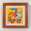 Painting of a cartoon girl with a devil hood on, driving an apple shaped car with stickers all over it.