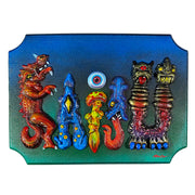 Bluish green wooden plaque with 3D raised parts atop it, spelling out "Kaiju." The parts are all various monsters and each colored individually.