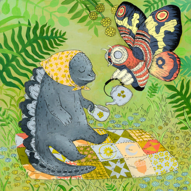 Painting of a storybook style Godzilla and Mothra, sharing tea atop a quilted picnic blanket. They sit in a green lush outdoor setting and Godzilla has a cute yellow headscarf.