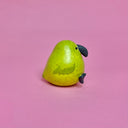 Small ceramic figure of a rounded, chubby green bird with a vase opening at the top of its head.
