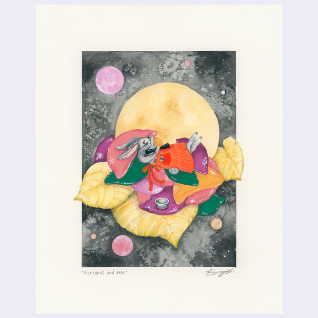 Illustration of a gray cartoon rabbit, wearing a red apron around the waist and laying atop a pile of cushions and yellow leaves. A large yellow moon and a dark sky is behind it.