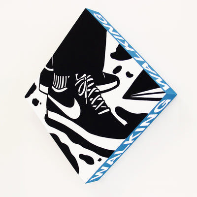 Square panel, turned so it is standing on its point. Side of the panel is blue and says "Walking" in white caps font. Front of the panel is a black and white graphic design style illustration of a person standing, only their shoes and pants leg visible. They wear Nikes.