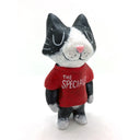 Sculpture of a black and white cat, standing on 2 legs like a person and wearing a red shirt that reads "The Specials." 