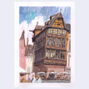 A watercolor painting of a historic European half-timbered building with a steep gabled roof, surrounded by other buildings and small figures at the street level, presented on a white paper background with a light gray border.