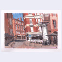 An impressionistic plein air style painting of a street scene with red and orange buildings, outdoor cafe umbrellas, and a central column, shown with a white border on a light gray background.