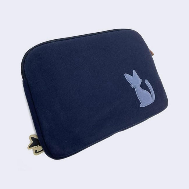 Back of navy blue pouch bag with an embroidery of a cat's silhouette in a lighter shade of blue.