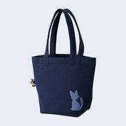 Back of navy blue tote bag with small embroidery of a silhouette of a cat. 
