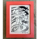 A framed black and white artwork featuring a cartoon illustration of two girls holding hands, one is roller-skating and the other skateboards while one holds a black umbrella. The drawing is housed in a bright coral-red wooden frame, displayed on a textured gray concrete surface.