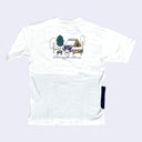 Back view of white t-shirt. A large graphic on the upper back depicts Kuromi sitting and excitedly eating in a nice picnic display near trees and a tent. Cursive text reads "Let's enjoy the outdoors!"