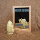 Framed mirror with cut wood letters which spell out “Giant Robot” and “30th year edition”, “Feat you!”. This imitates the cover of Giant Robot Zine, but the “cover” will be of the person looking into the mirror. Which invokes a sense of being part of the 30 years of Giant Robot Zines.