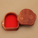 Wooden trinket box shaped like a robot head. The lid is slid off to show a red felt interior.