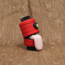 Turned and hand carved wood figure of a Ghost Lantern Yokai with its tongue out. Can be hung by the metal hanging thing, or can sit on a flat surface.