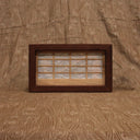 Shadow boxed type piece, a Shoji screen. When the light is turned on there is a silhouette of a Rokurokubi, aka Snake Neck Woman holding a hand fan. Can be hung by the sawtooth bracket or can sit on a flat surface.