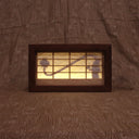 Shadow boxed type piece, a Shoji screen. When the light is turned on there is a silhouette of a Rokurokubi, aka Snake Neck Woman holding a hand fan. Can be hung by the sawtooth bracket or can sit on a flat surface.