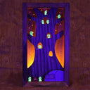 Wooden sculpture contained in a back lit box of a tree, with many small cute ghostly characters (kodamas) peeking out. 