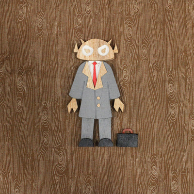 Wooden toy figure of a character with the head of a Big Boss Robot, wearing a gray suit with a red tie and a briefcase as an accessory.