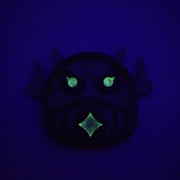 Glowing green face on a dark blue background