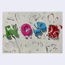 Colorful fridge magnet letters spelling out 'NOPE' on a textured surface with water droplets obscuring the word.