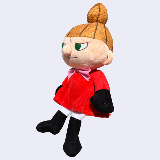 Plush doll of Little My, a character with a sassy expression, looking off to the side. She has a  tall ponytail and red dress.