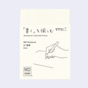 MD Notebook, cream colored in A7 size with a sleeve with product information.