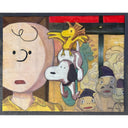 A stylized painted scene featuring a large pale face on the left, a black-and-white dog in the center, a small yellow bird-like creature above it, and several smaller faces in the background near a painted screen. 