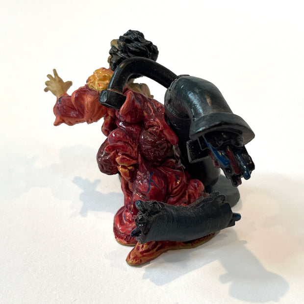 Vinyl figure of Testuo from Akira, a young boy almost totally mutated into a dripping blob. Large metal pipes come out his back.