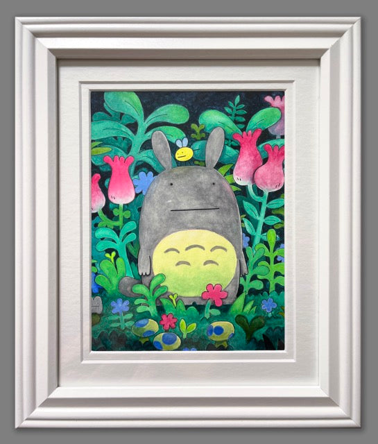 Illustration of a very stylized Totoro, with tiny dots for eyes, standing amongst colorful foliage. Framed.