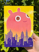 Illustration of a pink creature looming very largely with a cute, innocent smile over a city skyline on a yellow background