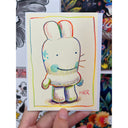 Colored pencil doodle of a bunny character with a large head and comical cute face.