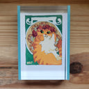 Illustration of a chubby and fluffy orange cat laying down with flowers around.