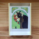 Illustration of a black cat looking behind itself with white and red flowers nearby.