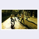 Painting of several boys all wearing a white t-shirt and paints playing soccer on a street.