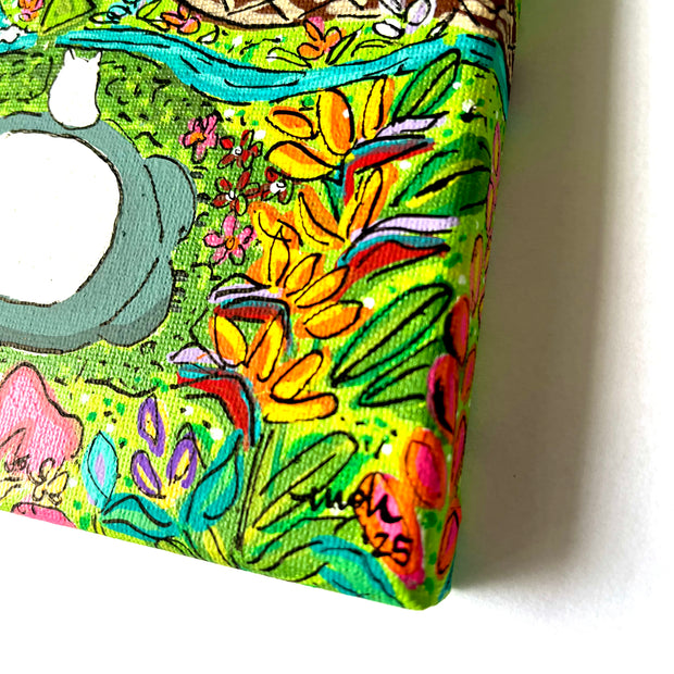 Colorful painting of Totoro, resting amongst Hawaiian foliage.