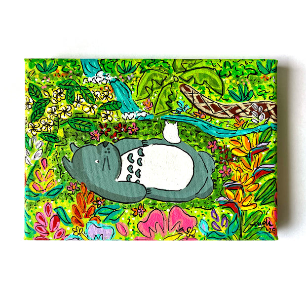 Colorful painting of Totoro, resting amongst Hawaiian foliage.