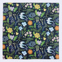 Bandana with floral and bird repeating pattern.