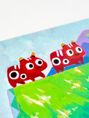 A colorful textured painting featuring 2 red cartoon ox figures, with large white eyes on a green grassy hill, with purple mountains, blue sky, red Japanese characters, and three small bottles with yellow caps at the bottom right.
