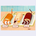 3 Swiss Rolls on a platter, each with a cat head and a cat tail.