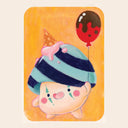 A cute pastel illustration of a round character with pink cheeks and a striped blue-green and navy hat, holding a pink ice cream cone and a red balloon with dark brown chocolate drizzle, set against a warm orange background.