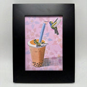 Painting of a Thai Tea boba in a plastic cup with boba. A hummingbird sits on the cup and one flies nearby the straw.