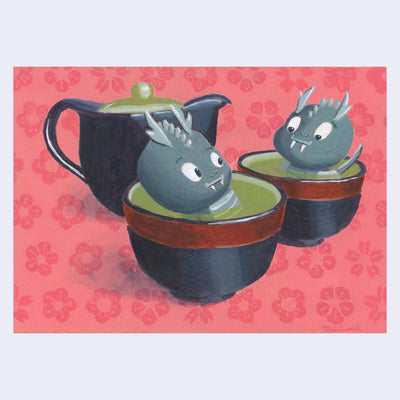 Illustration of a pair of 2 small cartoon dragons, sitting in a cup of green tea. Behind them is a black tea pot. Background is reddish pink with a painted flower pattern.