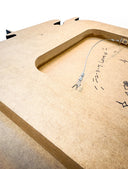 Backside of a MDF board with mounting hardware.