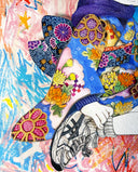 Framed artwork of a cartoon character in traditional Japanese attire with a dog, on a colorful abstract background.
