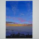 Landscape painting of a seaside view at sunset, with a mostly dark blue sky and an orange setting sun. Trees can be seen at the bottom of the scene.