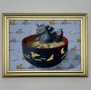 Framed artwork of a cat kaiju monster in a bowl of miso soup with a gold frame on a gray wall.