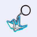 Die cut holographic keychain with an illustration of a white paper crane on it. "Giant Robot" is written in small black font in bottom right.