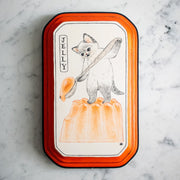 Black ink illustration on white paper of a cat standing and holding a large wooden spoon, scooping a molded orange jelly. Piece is mounted on an orange wooden plaque.