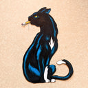 Drawing of a black cat with blue highlights smoking a cigarette. The cat is cut out of paper.