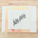 Stylistic font, akin to lightning bolts, reading "NEKO NOTES"
