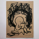 Cartoon character reading a book on kraft paper with scribbles above its head.